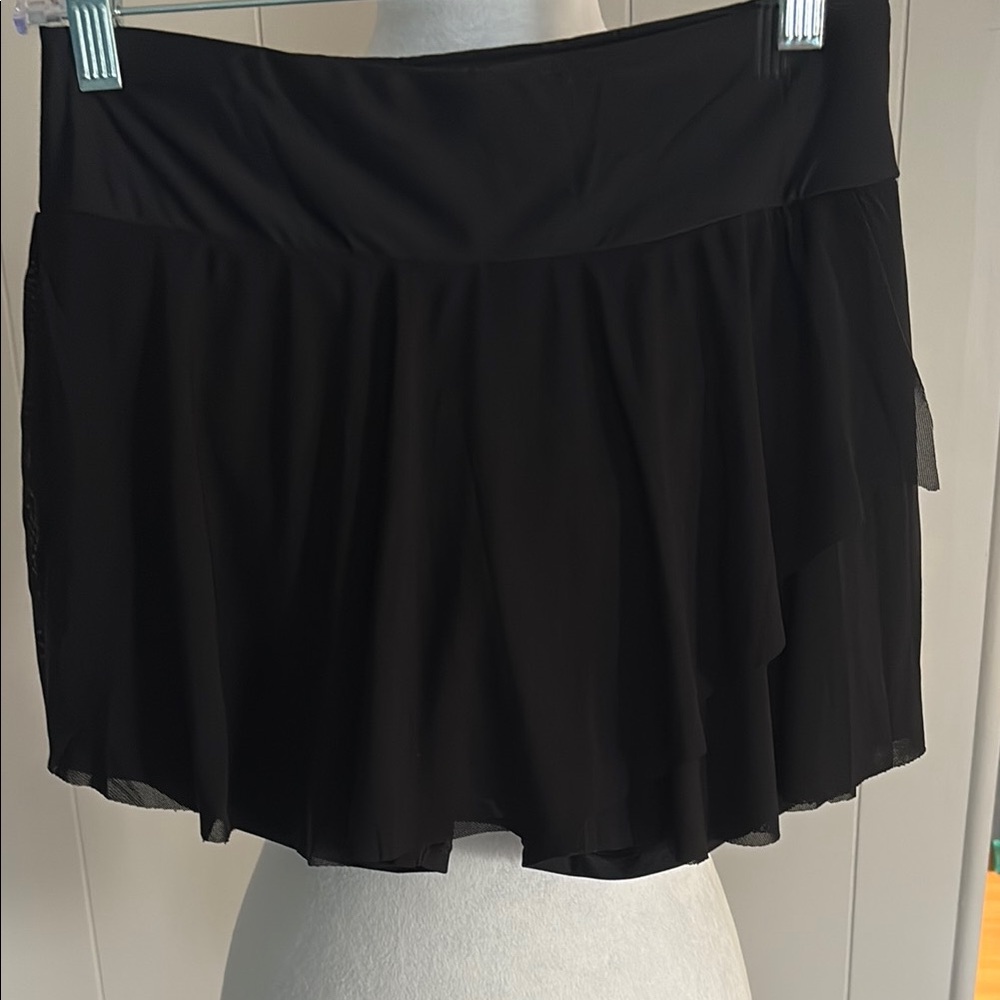 Black bathing suit, bottoms skirt style with shorts underneath